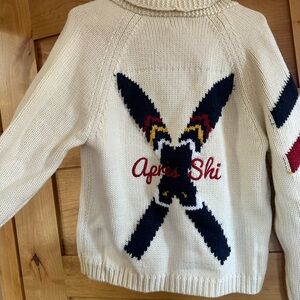 Cream “Apres Ski” Cardigan with Navy and Red Accents.